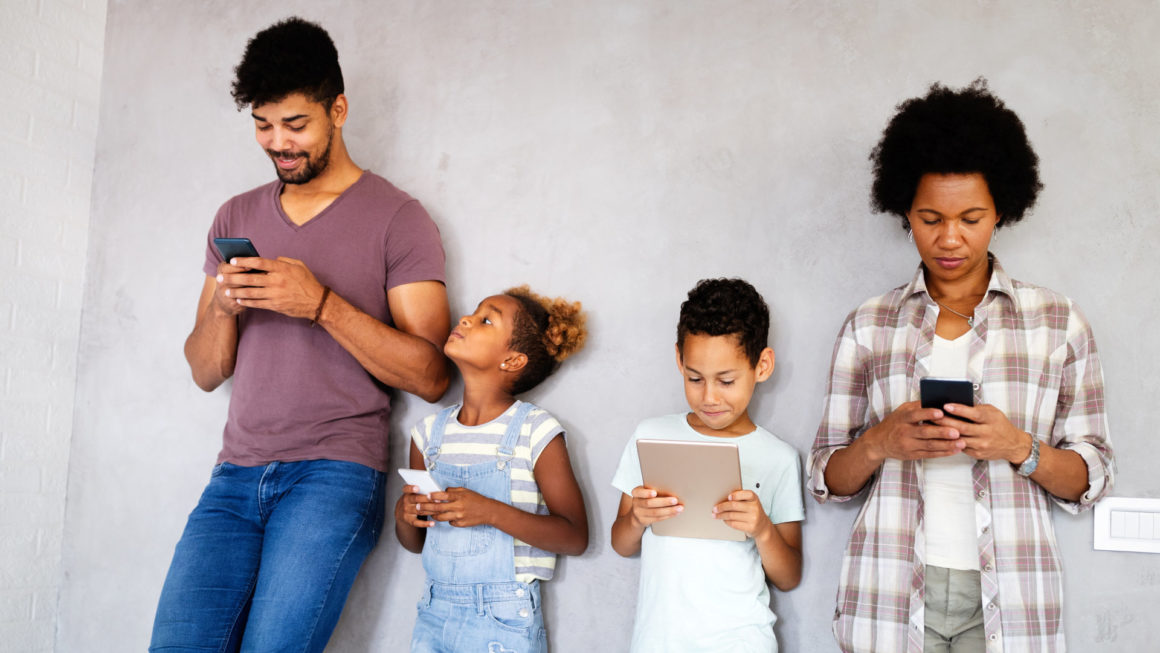 Family sharing there privacy data by using digital devices, phones, tablets Teach Children to Love God